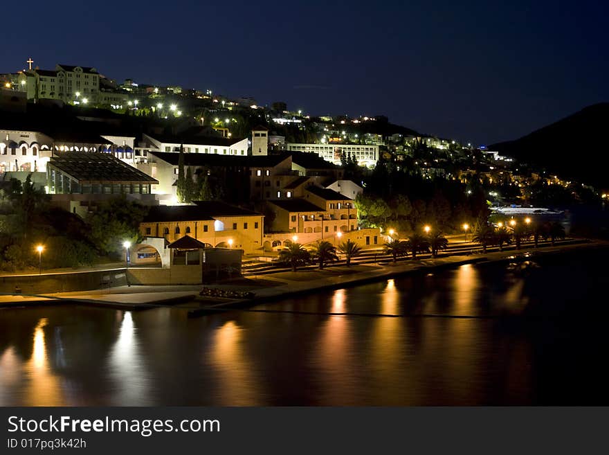 Seaside resort by night, illuminated by street lamps