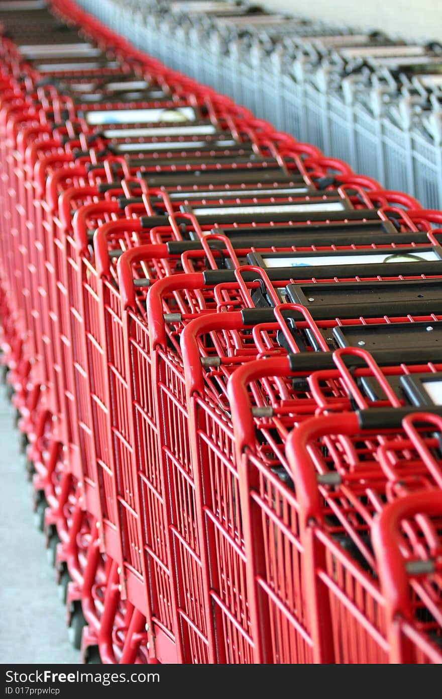 Row of red metal shopping carts