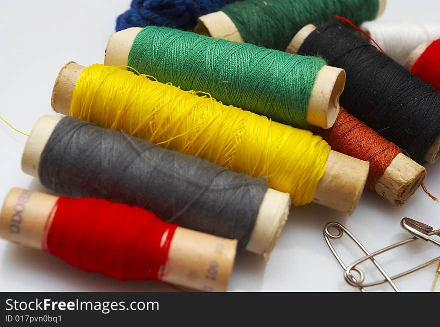 Isolated colorful string clews on white background.