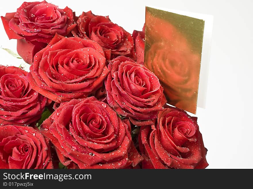 Background from red roses whit gold note card