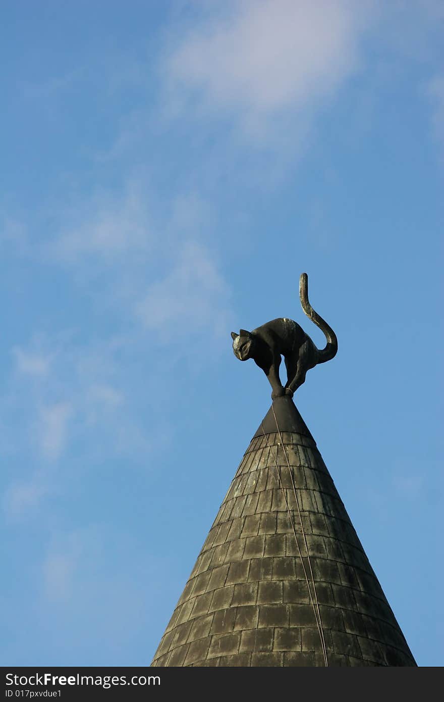 Rooftop with a cat figure