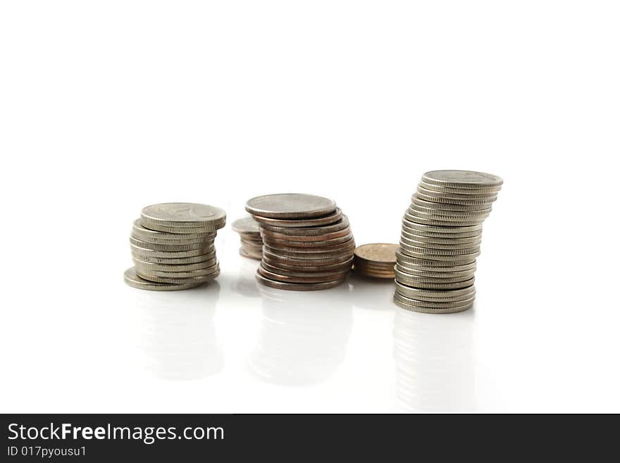 Rouleaus from coins, isolated on a white background