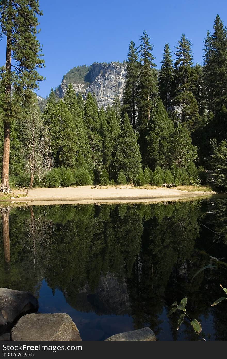 A mountain view that reflects in a lake. A mountain view that reflects in a lake