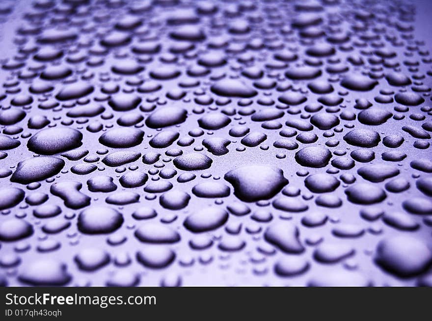 Water drops on shiny surface