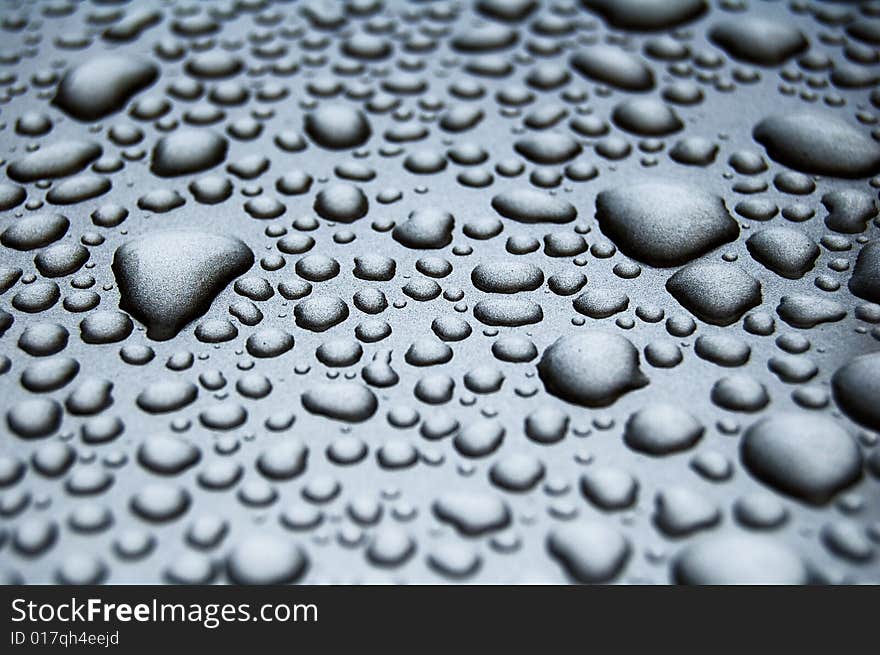 Water drops on shiny surface