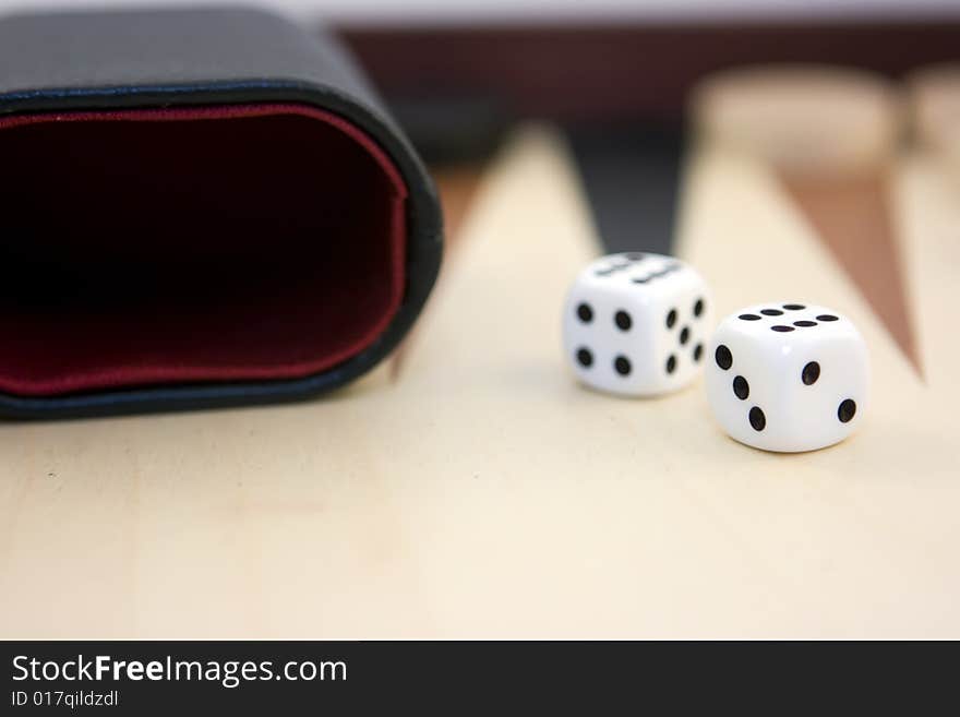 Two dices on backgammon board. Two dices on backgammon board