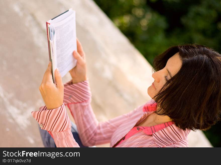 Young Female Reading In Park