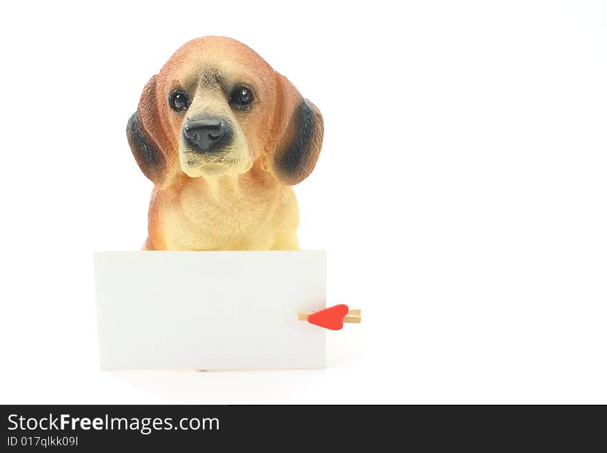 Toy dog, a boxer with the card and heart