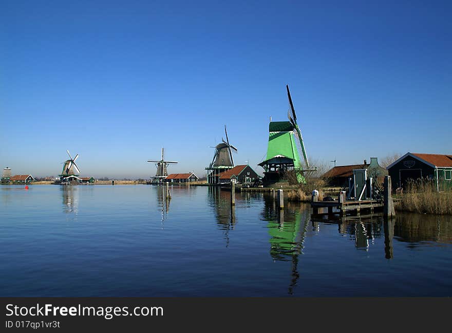 Four wind mills on a row