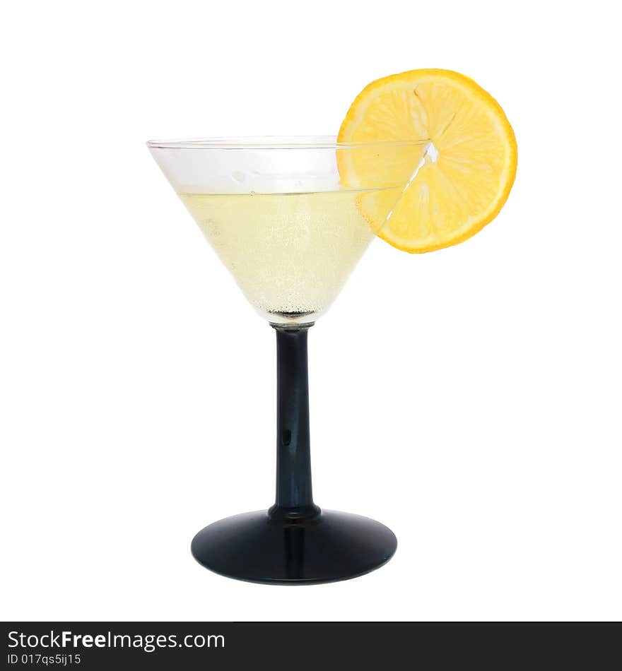 Cocktail in cocktail glass with slice of lemon