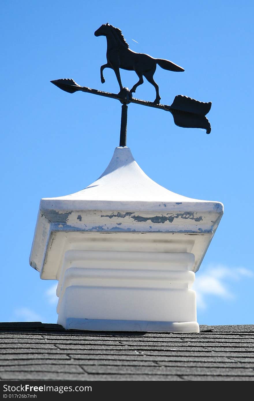 Weathervane on top of small barn