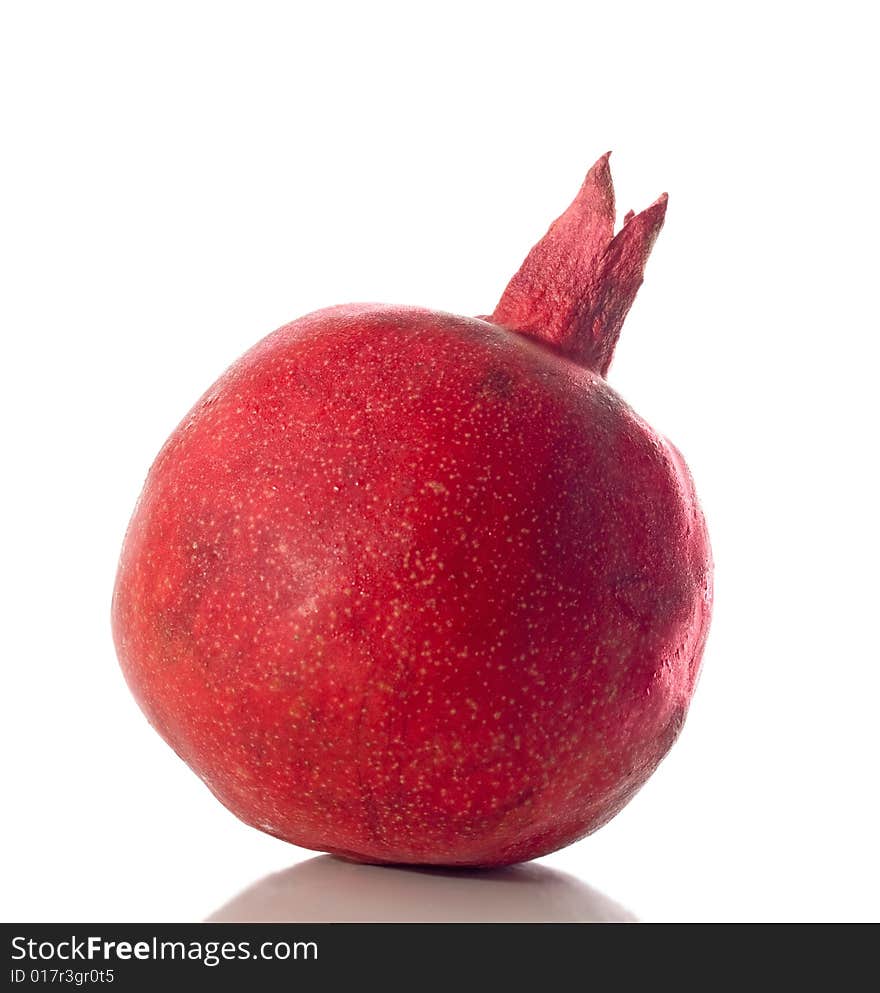 Whole pomegranate isolated on white