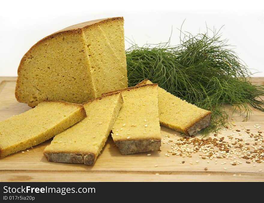 Fresh yellow corn bread display with seeds and herbs