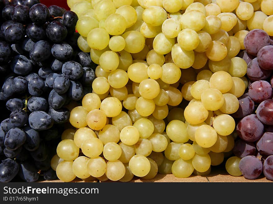 Display of fresh colourful grapes on market in Europe