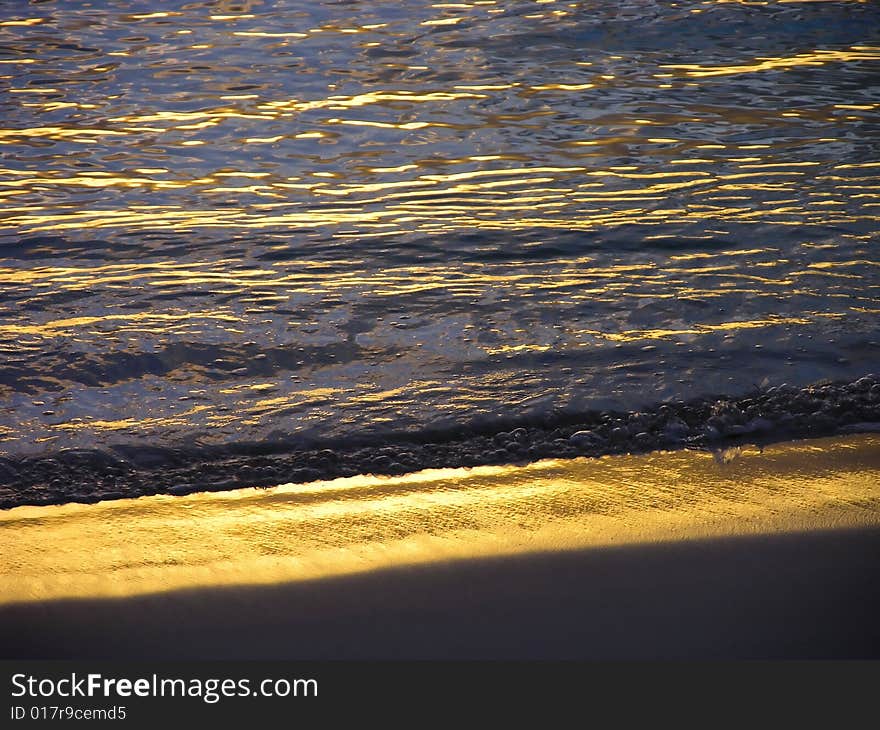 Sunset makes a lovely glow on a beach in Bermuda. Sunset makes a lovely glow on a beach in Bermuda.