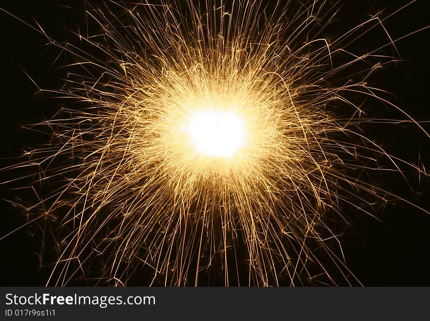 Close-up of electric sparkler on dark background. Close-up of electric sparkler on dark background