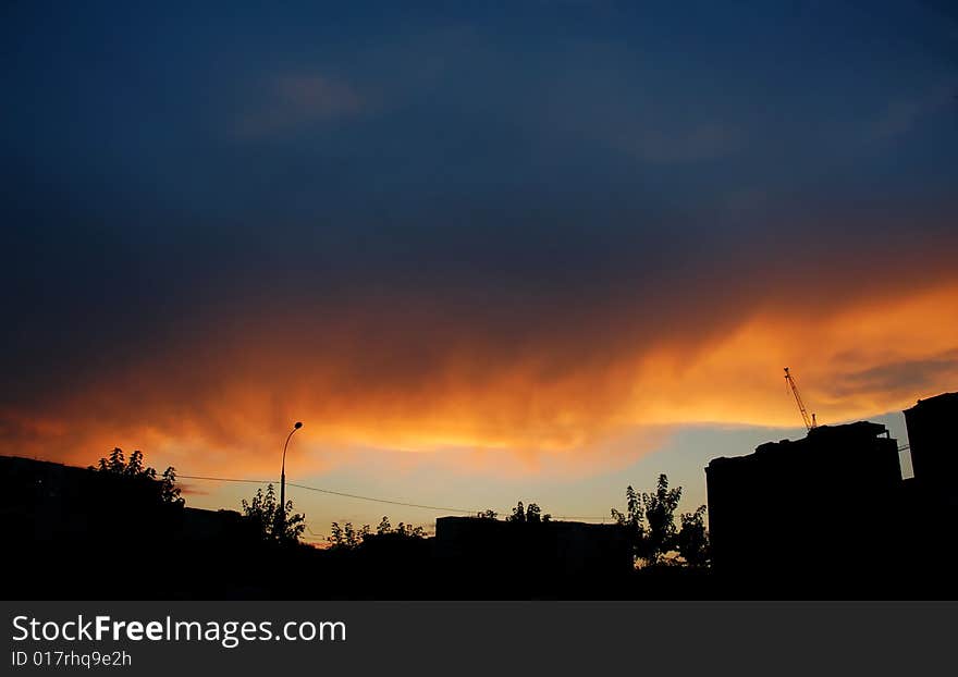 This photograph represents a colorful dramatic sky with cloud at sunset