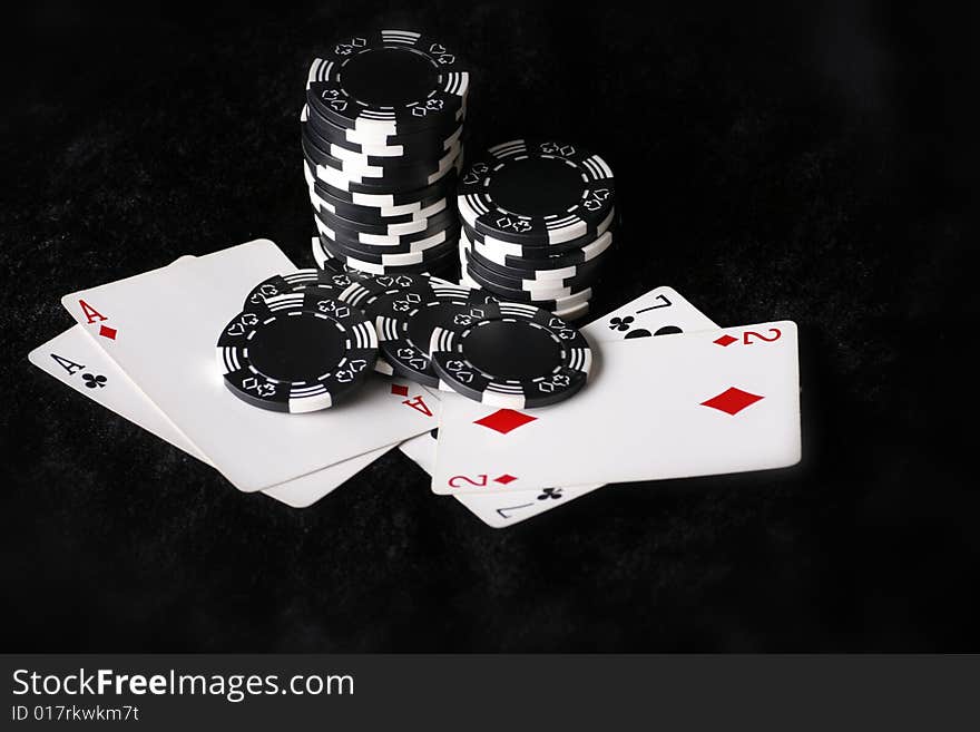 Best and worst possible poker hands to start with. Black background. Best and worst possible poker hands to start with. Black background.