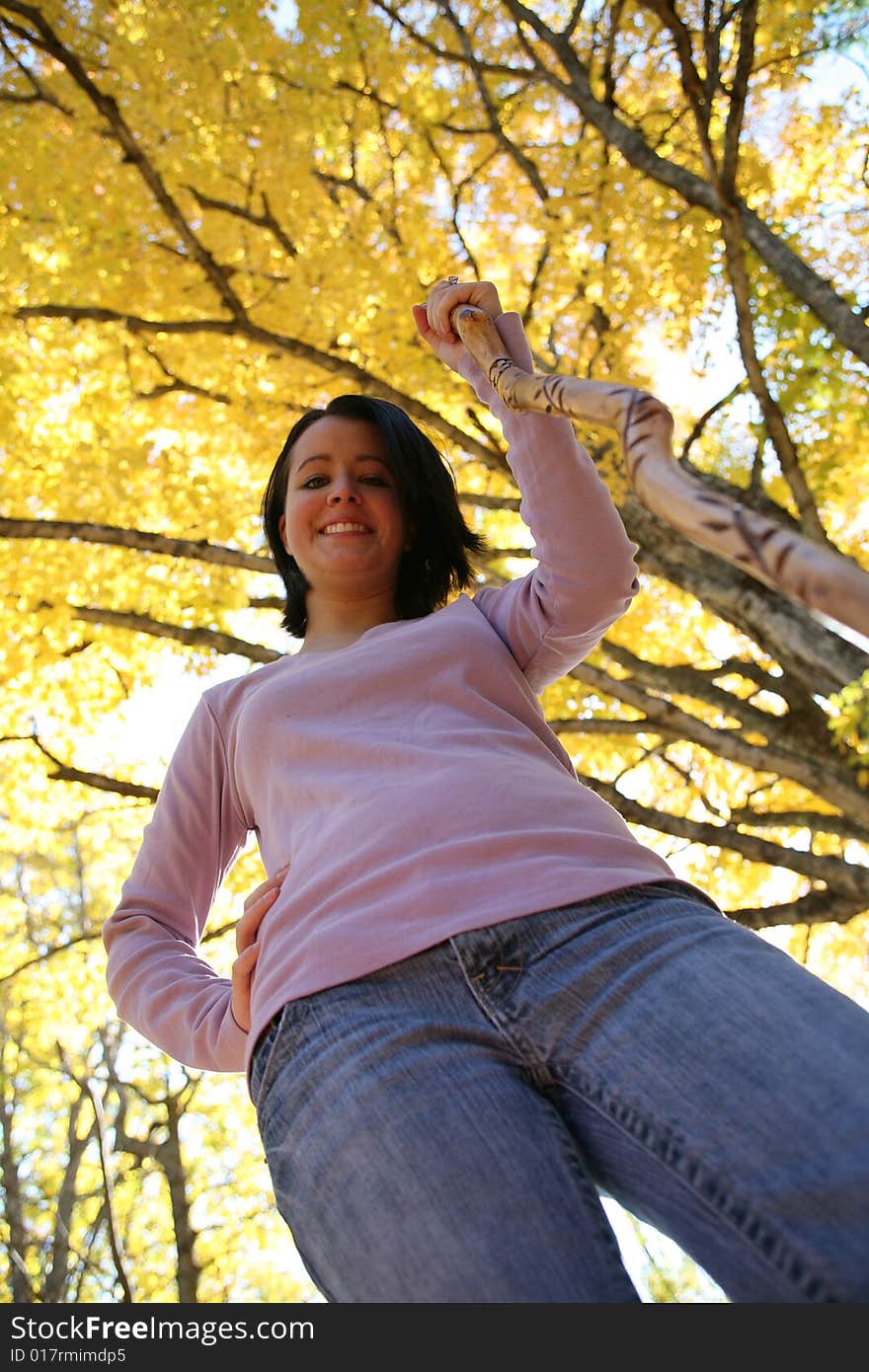 Pretty teenage girl and bright yellow leaves