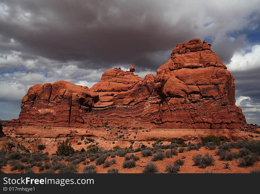 View of the red rock formations in Arches National Park with blue sky�s and clouds. View of the red rock formations in Arches National Park with blue sky�s and clouds