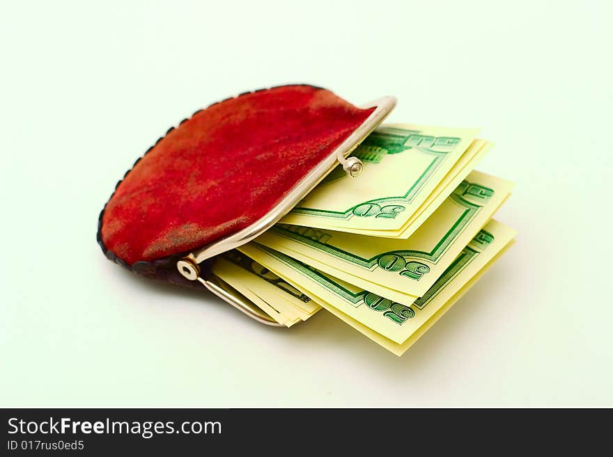 Purse full of dollars on a white background