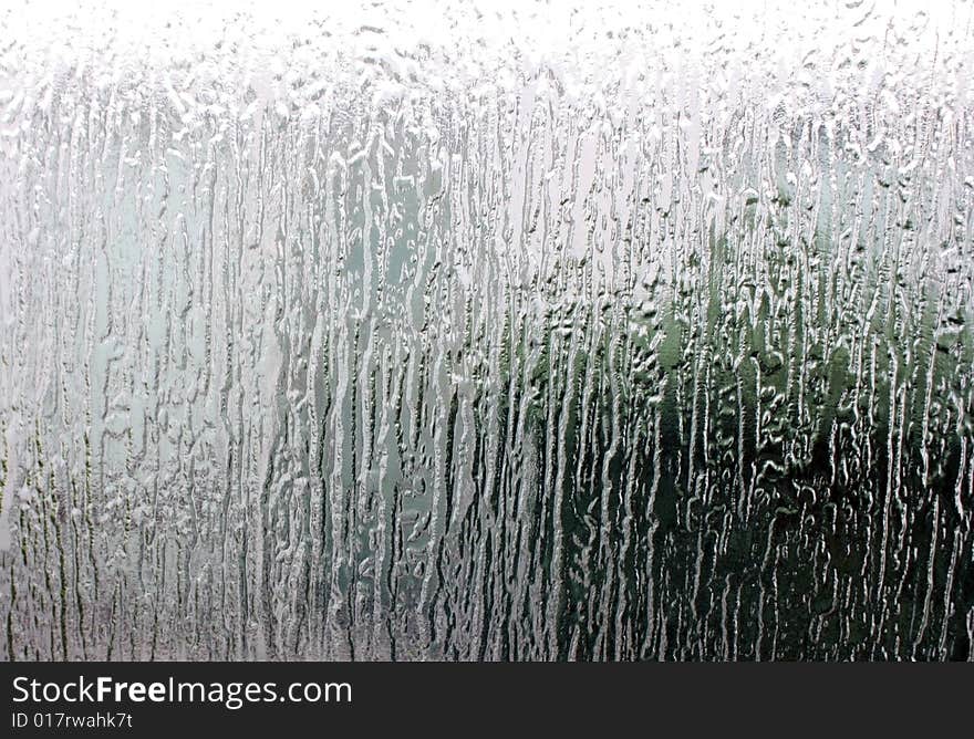 Rippled glass with light shining through. Background.