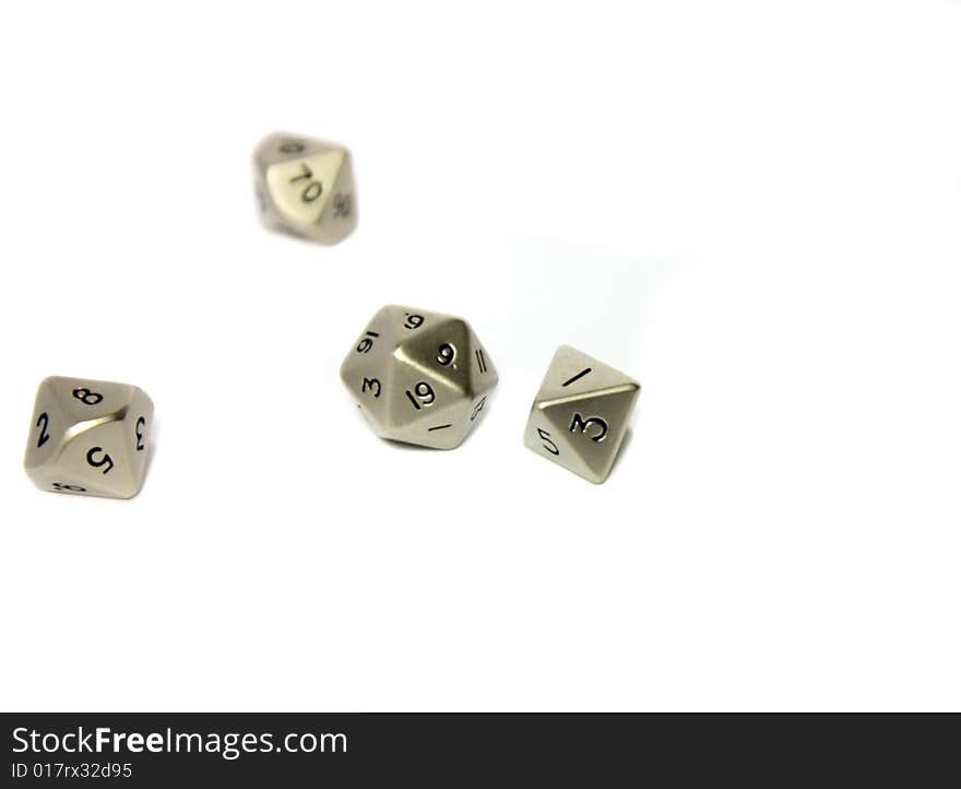 Small metal dice on white background