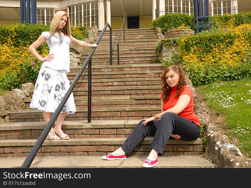 Portrait of two pretty girls, blond and redhead, outside. Portrait of two pretty girls, blond and redhead, outside