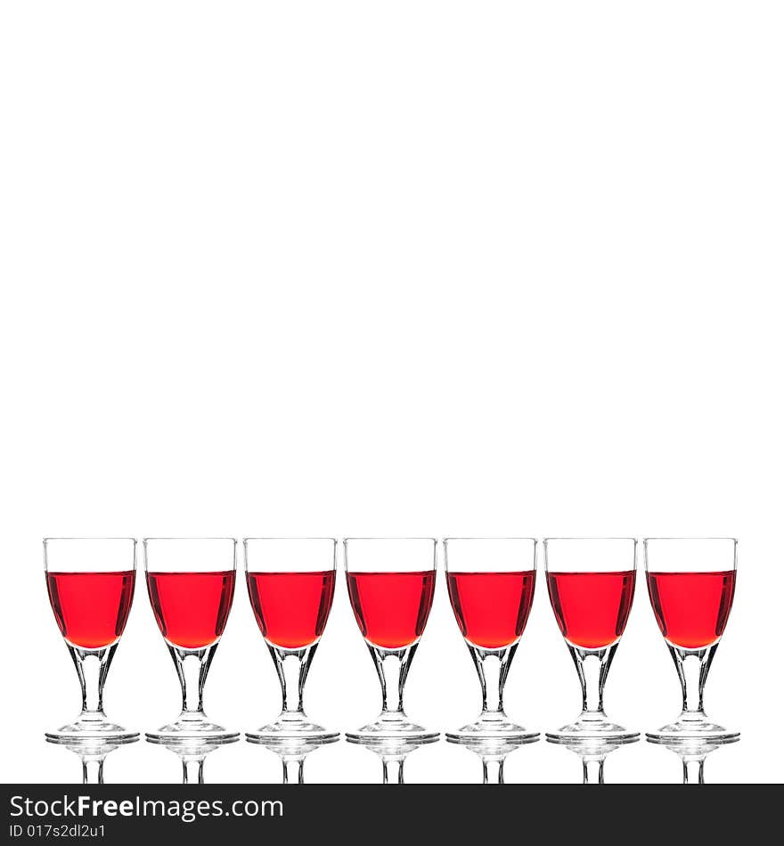 Wine glasses with red cocktail on white background