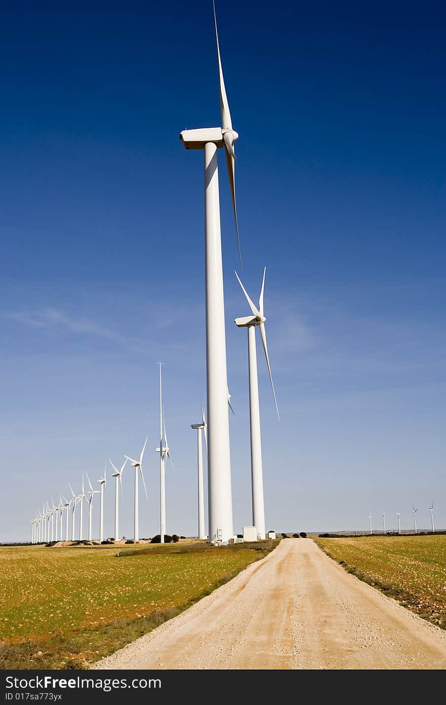 Photo of wind turbines field.