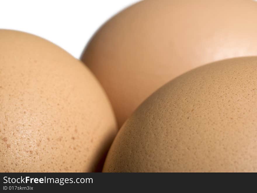 Three eggs over white background