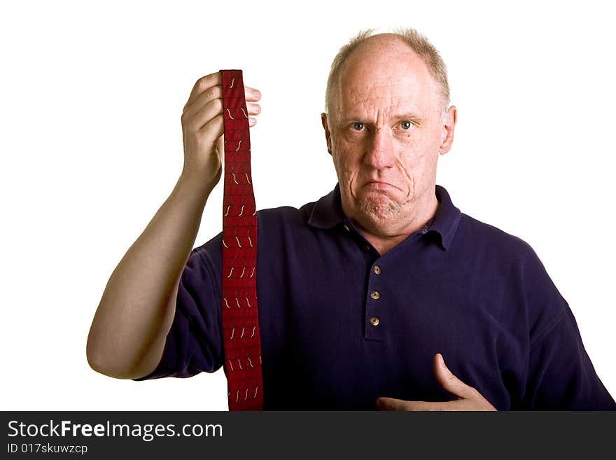 An older bald guy showing his dislike for a tie. An older bald guy showing his dislike for a tie