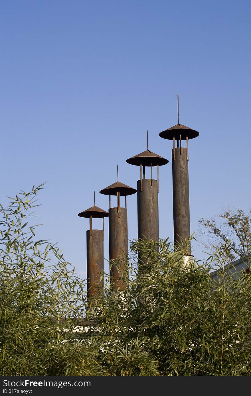 Industrial chimney against blue sky