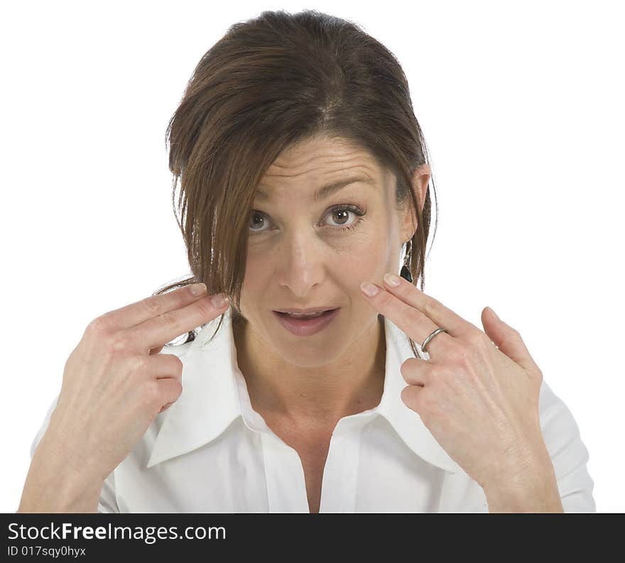 Portrait on white background of a forty years old woman in studio indicating yourself. Portrait on white background of a forty years old woman in studio indicating yourself