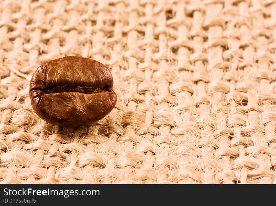 Coffee bean on a jute background