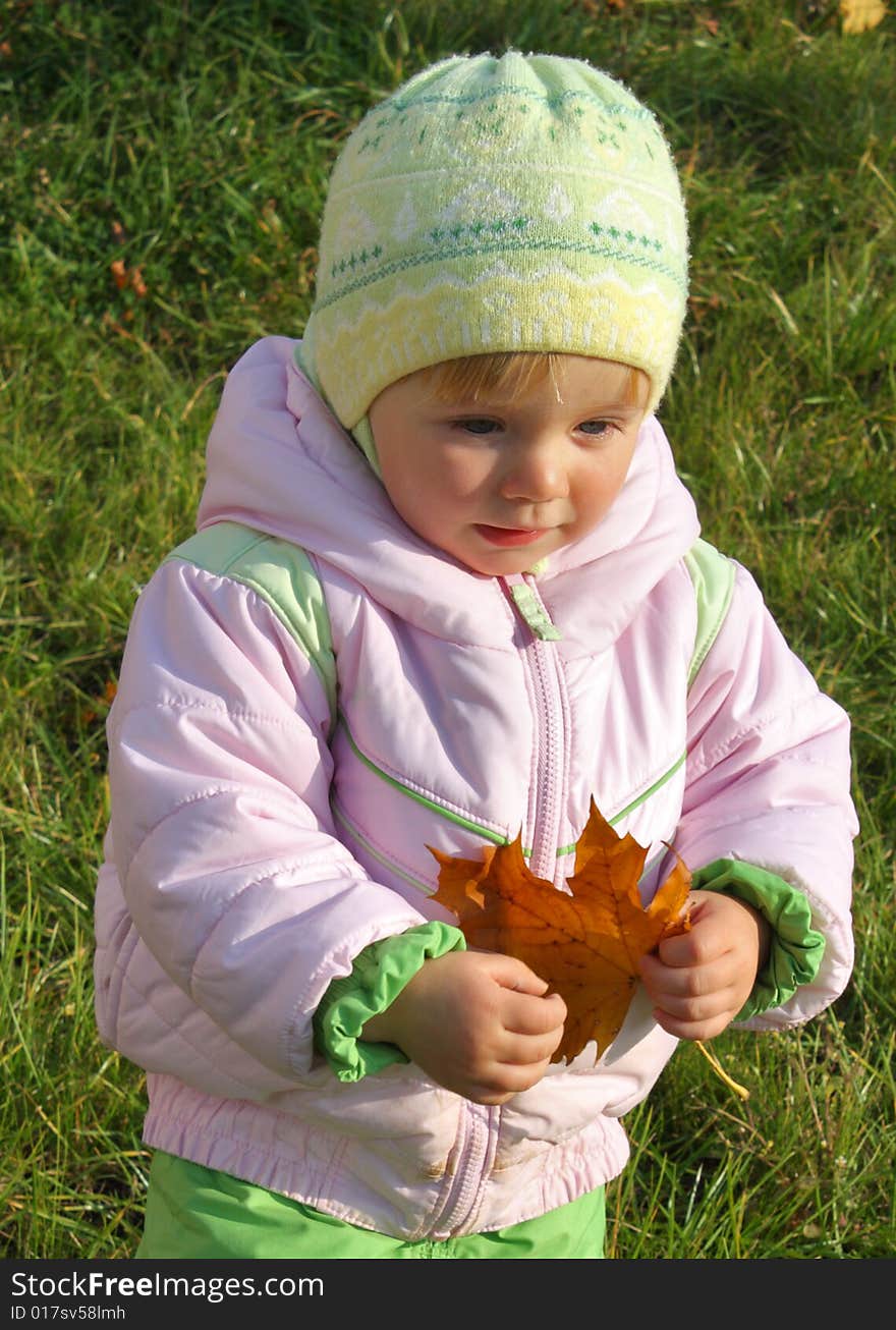 Little girl with maple-leaf