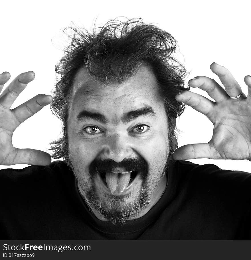 Angry man screaming in extreme rage, BW