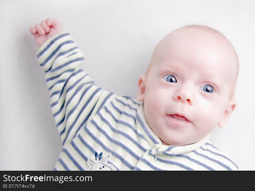 Newborn baby over light background