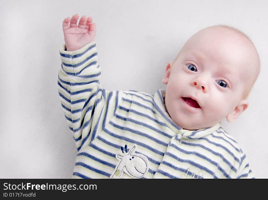 Newborn baby over light background