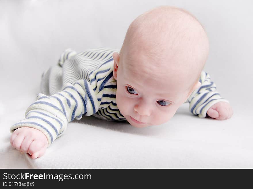 Newborn baby over light background