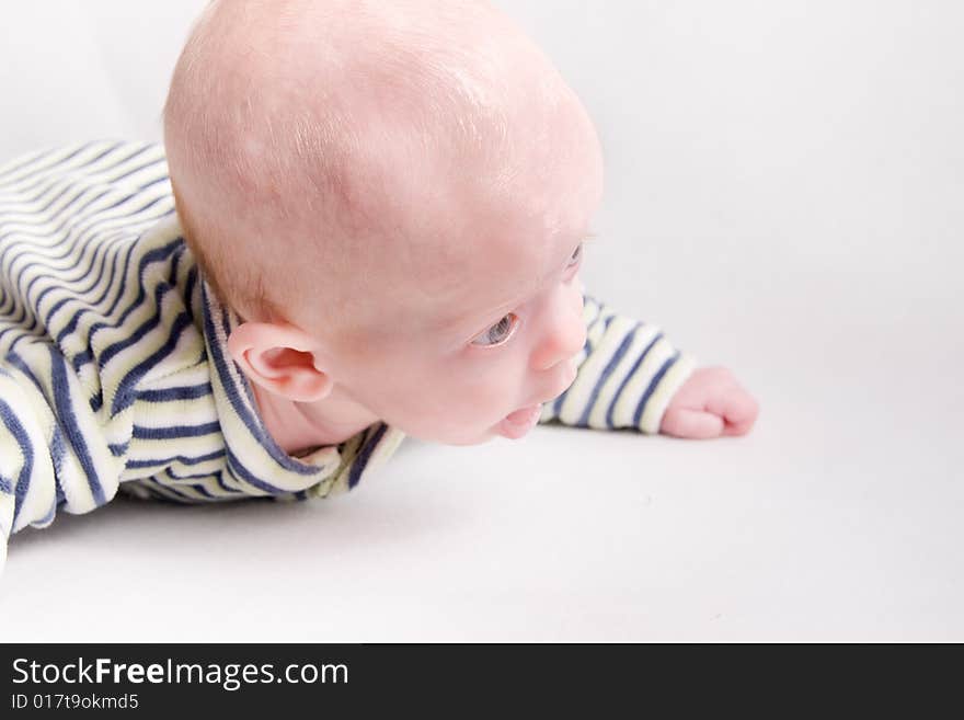 Newborn baby over light background