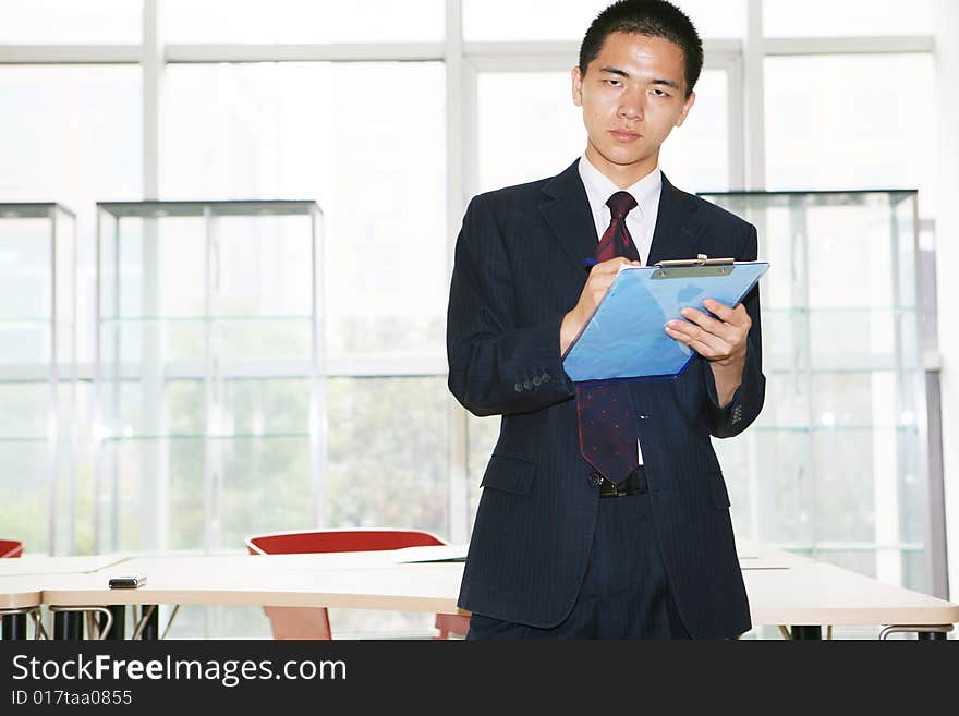 A young asian working in office