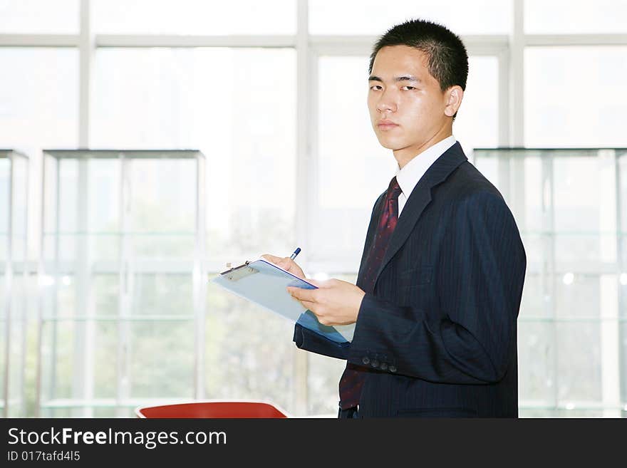 A young asian working in office