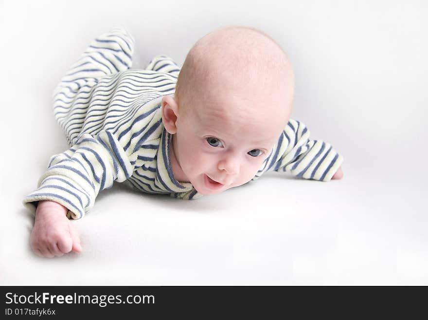 Newborn baby over light background