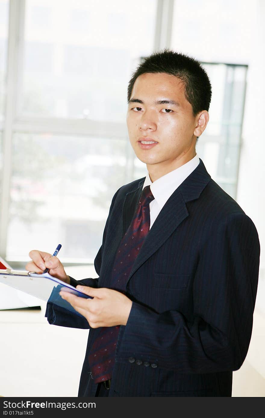 A young asian working in office