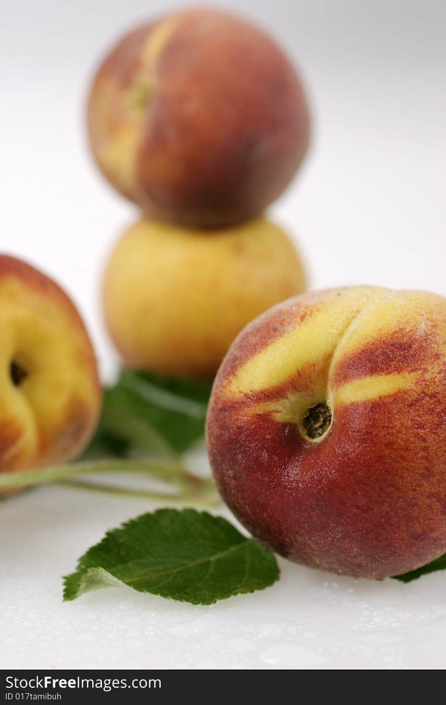 Still life of four juicy aprikots