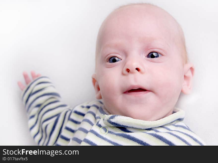 Newborn baby over light background