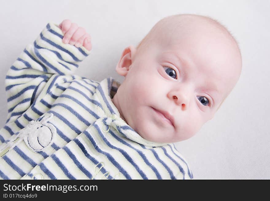 Newborn baby over light background