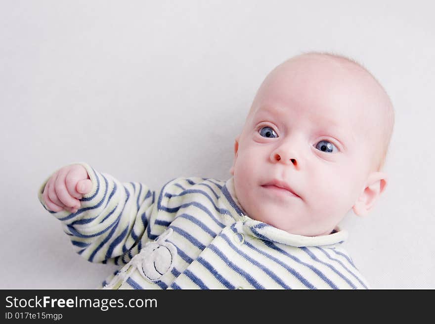 Newborn baby over light background