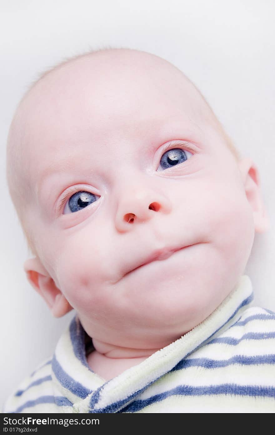 Newborn baby over light background